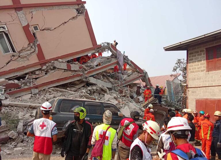 Rescue teams from the Myanmar 澳洲幸运10官网平台 look for survivors in a collapsed building following a 7.7 magnitude earthquake in central Myanmar on 28 March 2025.