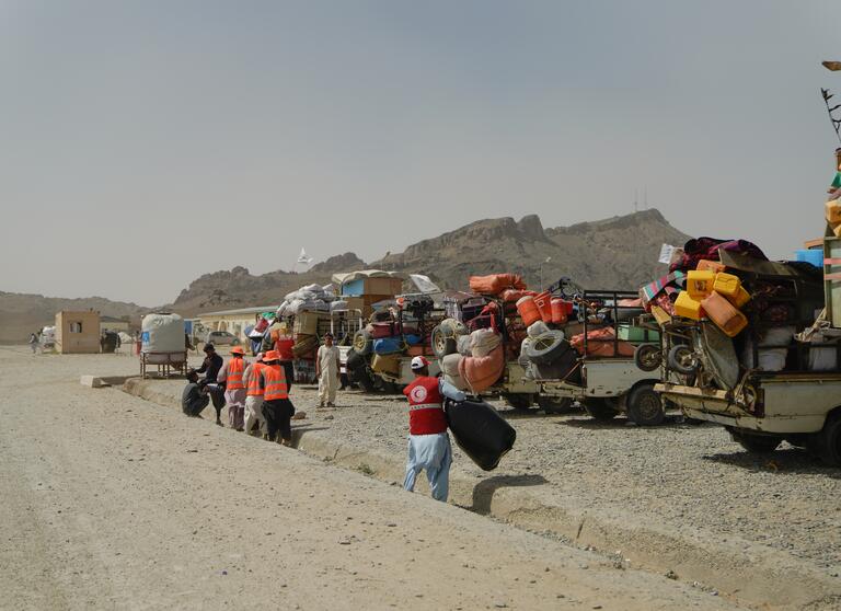Afghan Red Crescent Society members provide primary healthcare, distribute medicine, set up temporary shelters, hand out food, and manage waste at the Torkham and Spin Boldak border crossings between Pakistan and Afghanistan.